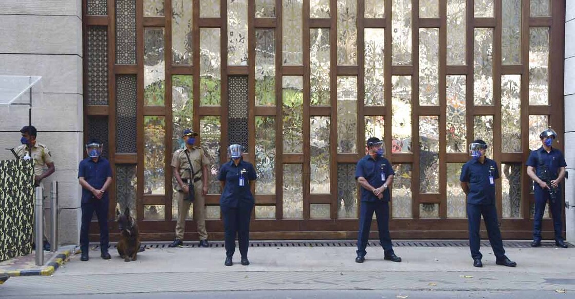 Police personnel guard outside industrialist Mukesh Ambani's residence Antilla