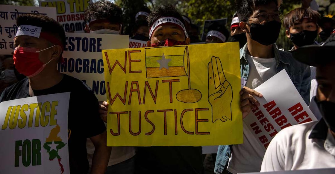 Myanmar citizens living in India hold placards during a protest, organised by Chin Refugee Committee, against the military coup in Myanmar, in New Delhi