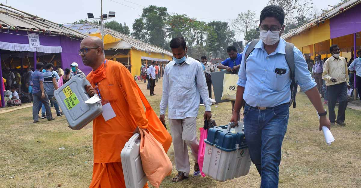 Fifth phase polling underway in Bengal; bypoll in Rajasthan, Uttarakhand & Karnataka Polling officials carrying Electronic Voting Machines and other materials to a polling centre, ahead of 5th phase of West Bengal Assembly Polls, amid surge in Covid-19 cases across the country. PTI