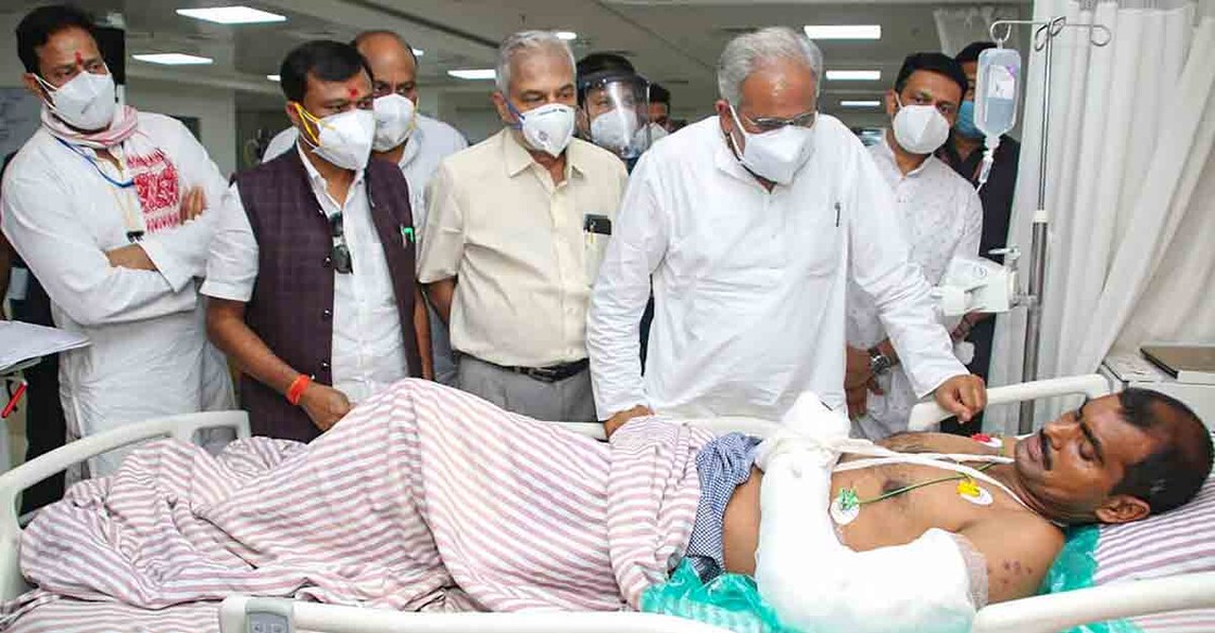 **EDS: IMAGE MADE AVAILABLE FROM CM OFFICE** Raipur: Chhattisgarh Chief Minister Bhupesh Baghel visits a CRPF jawan injured in Bijapur Naxal attack, at a hospital in Raipur, Sunday, April 4, 2021. (PTI Photo)(PTI04_04_2021_000143B)