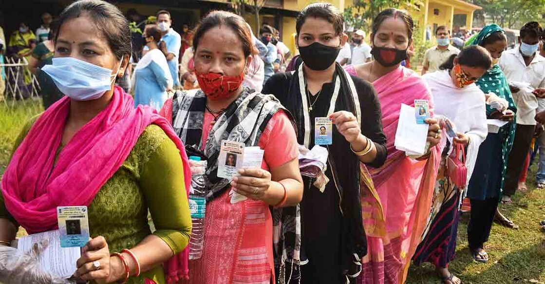 Guwahati: Voters queue up to cast their votes at a polling station, during the third and final phase of Assam Assembly elections, in Guwahati, Tuesday, April 6, 2021.  (PTI Photo) (PTI04_06_2021_000041B)
