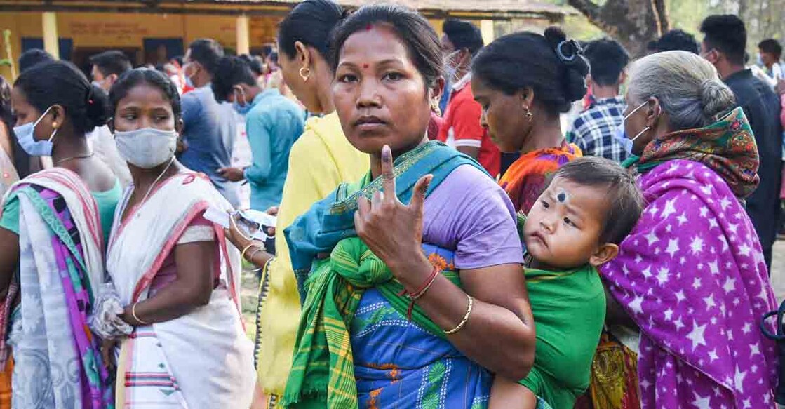 Baksa: A Bodo tribal woman shows her finger marke with indeligible ink after casting her vote during the  3rd phase of  the State Assembly election, at Uttarpara in Baksa district, Tuesday, April 6, 2021. (PTI Photo) (PTI04_06_2021_000029A)