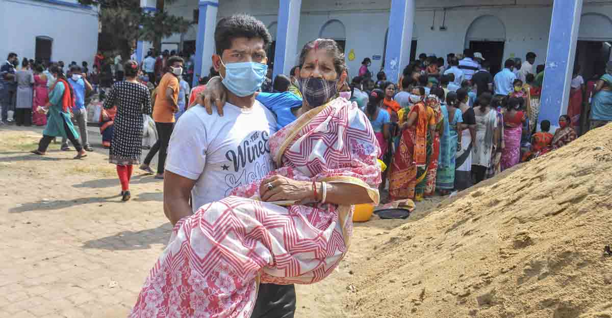 PTI04_06_2021_000073A South 24 Parganas: An elderly voter is carried at a polling station during the third phase of West Bengal Assembly elections, at Baruipur in South 24 Parganas district, Tuesday, April 6, 2021. (PTI Photo) (PTI04_06_2021_000073A)