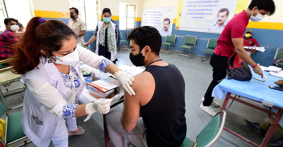 COVID-19 A medic administers a dose of COVID-19 vaccine to a young person, at a vaccination centre in New Delhi. PTI