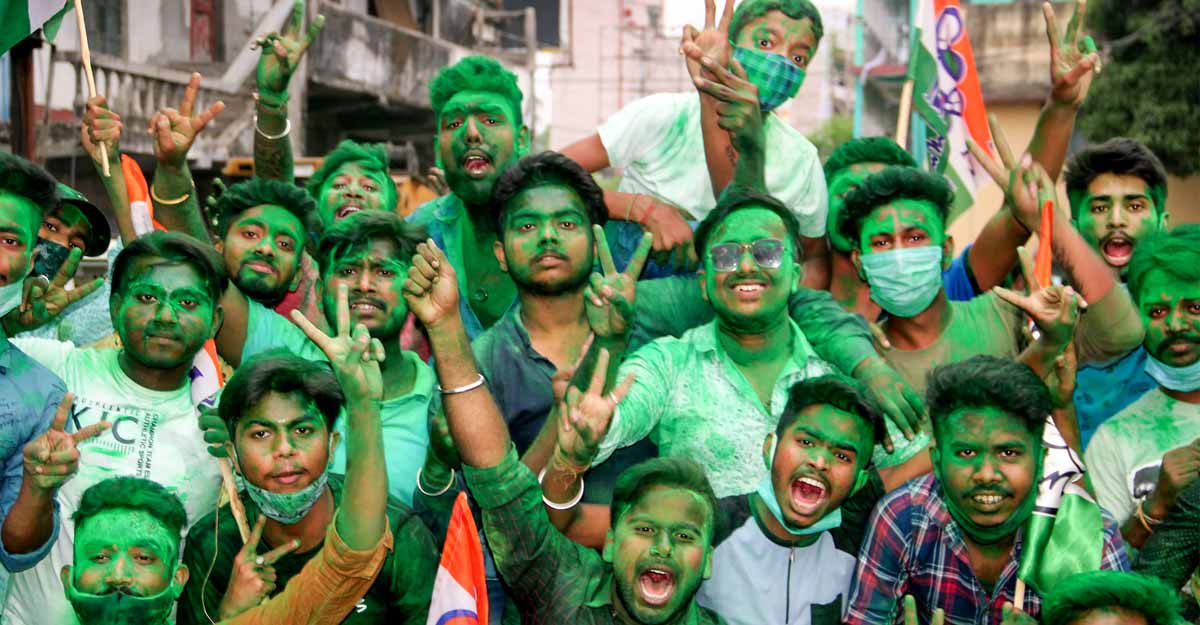 Trinamool Congress Trinamool Congress activists celebrate their party's winning trend during counting day of West Bengal Assembly Election 2021, in South Dinajpur district, Sunday, May 2, 2021. PTI
