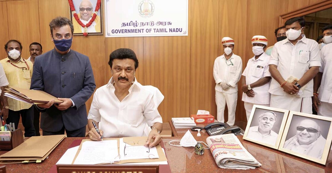 Newly sworn-in Tamil Nadu Chief Minister MK Stalin does his first signature, at his office in the Secretariat, in Chennai, Friday, May 7, 2021. PTI