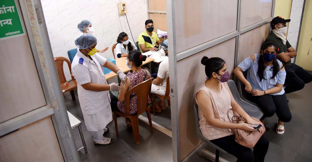 Beneficiaries receive a dose of COVID-19 vaccine at NMMC Hospital Vashi, Mumbai, Saturday, May 8, 2021. PTI