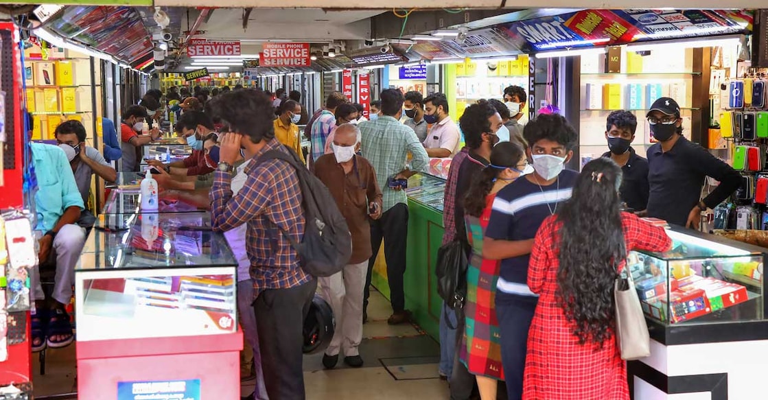 People purchase mobile accessories after relaxations in COVID-induced lockdown, in Kozhikode, Friday, June 18, 2021. PTI