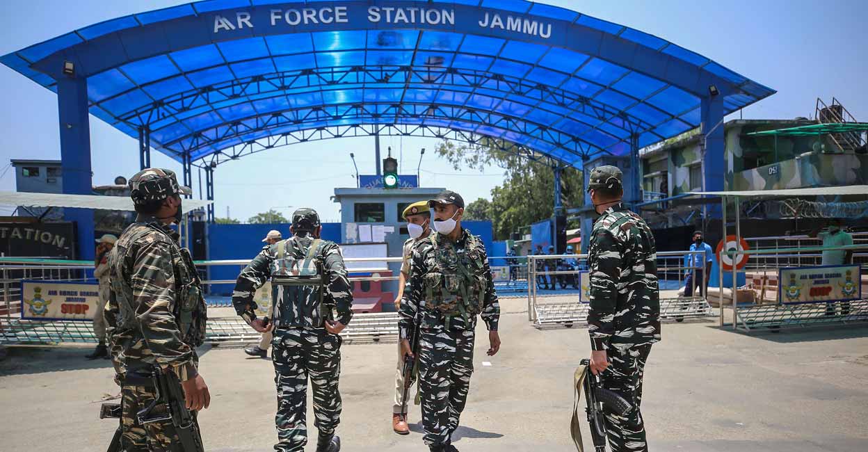 Security personnel stand guard outside Air Force Station after two low intensity explosions reported in the technical area of Jammu Air Force Station in the early hours of Sunday. PTI