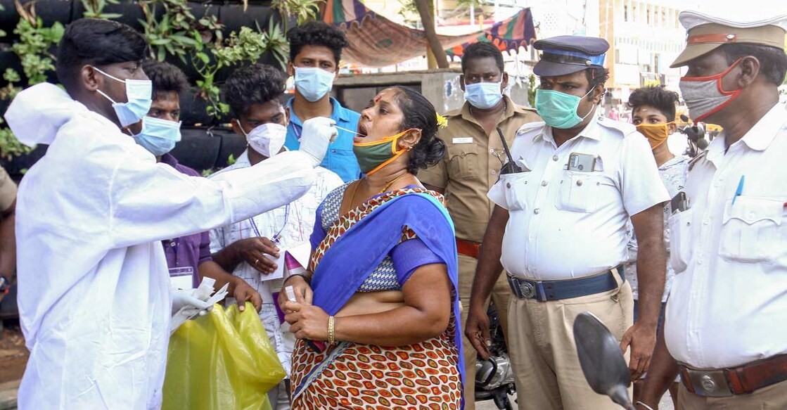  A medic collects a swab sample from a person for Covid-19 testing during COVID-induced lockdown, in Chennai, Friday, June 4, 2021. Photo: PTI