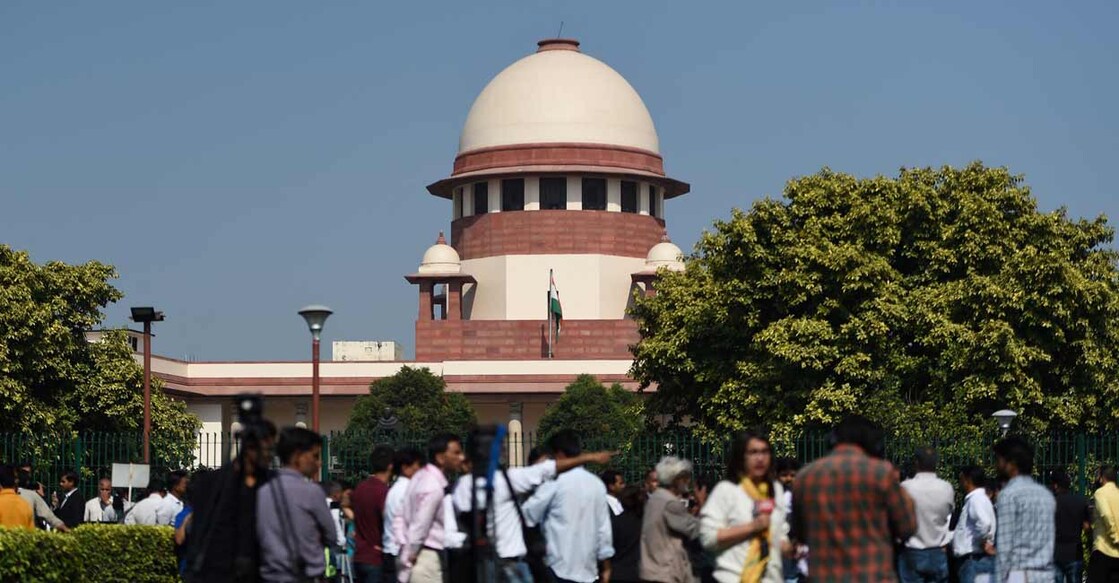 Members of the media gather at the Supreme Court in New Delhi on November 9, 2019. Photo: Money Sharma/AFP