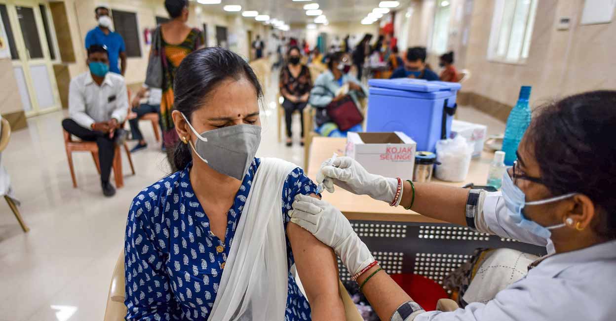 COVID A health worker administers COVID-19 vaccine to a beneficiary at Moti Lal Nehru Medical College in Prayagraj on Friday. PTI