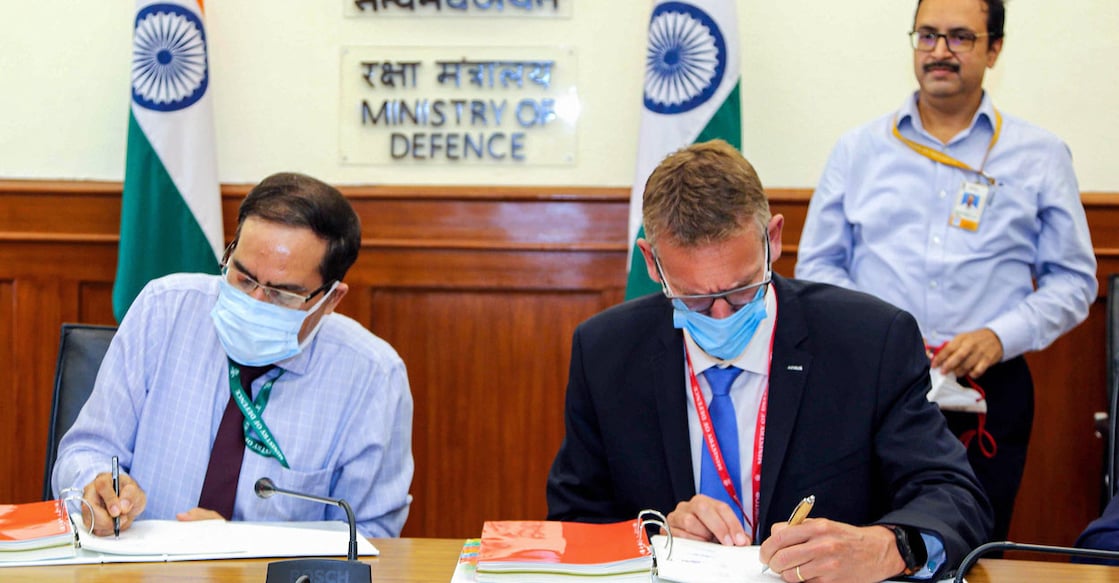 PTI09_24_2021_000069B Officials during signing of an contract between Ministry of defence and Airbus Defence & Space, Spain for acquisition of 56 C-295MW transport aircraft for IAF, in New Delhi, Friday, Sept. 24, 2021 Photo: PTI