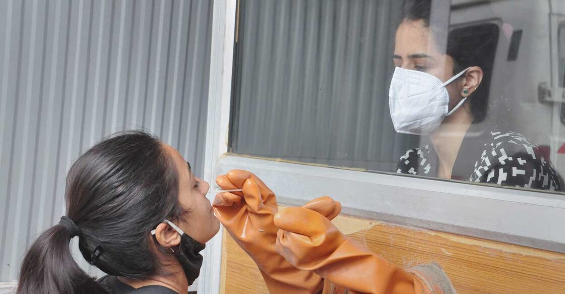 A health worker takes nasal sample for Covid-19 testing at a Regional Hospital in Kullu district, Friday, Sept. 3, 2021. PTI