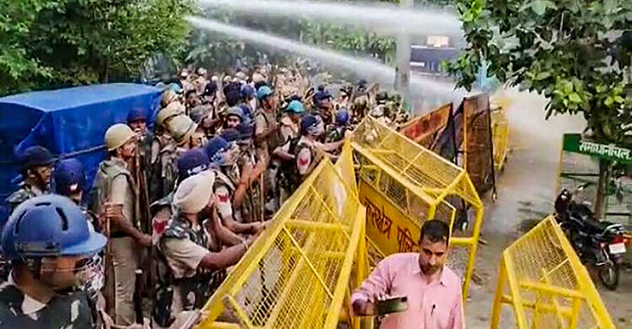 PTI09_07_2021_000178B Police use water cannons to disperse farmers who were staging a protest in Karnal. Photo: PTI