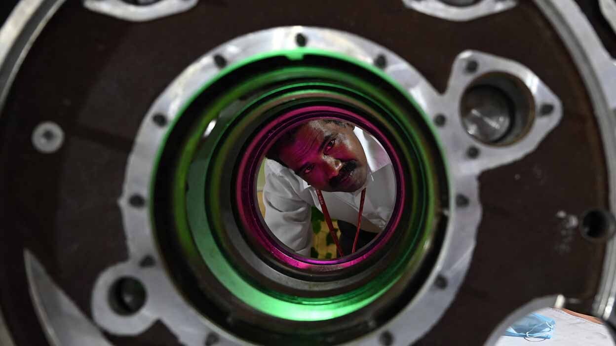 INDIA-DEFENCE-EXHIBITION A person examinig parts on display during an exhibition at Chennai. File Photo: AFP