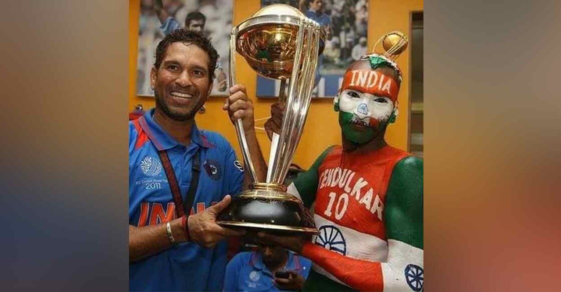 Sudhir with Sachin Sudhir Kumar (right) poses with Sachin Tendulkar after India's victory in the cricket World Cup in 2011. Photo: IANS