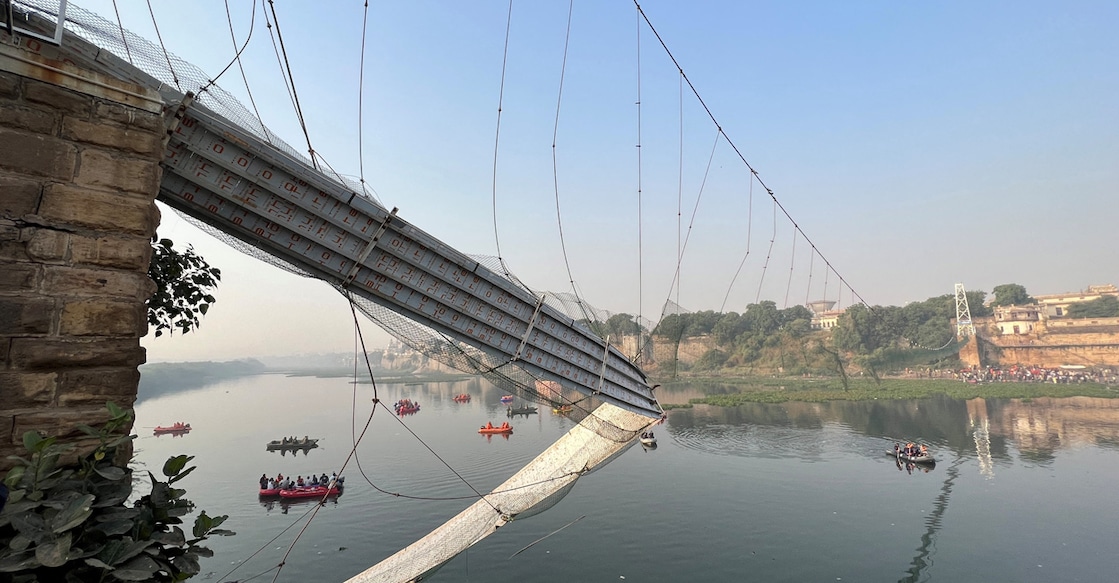Rescuers search for survivors after a suspension bridge collapsed in Morbi town in the western state of Gujarat. Photo: Reuters