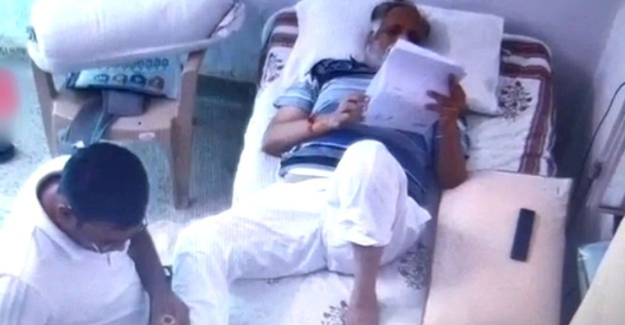 Jain (58), who is in judicial custody over money laundering charges, can be seen reading some documents and a man in a white T-shirt massaging his legs in the video.  Photo: IANS