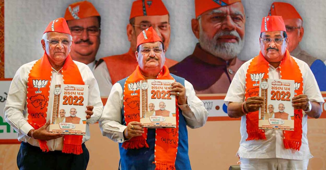 From left- Gujarat Chief Minister Bhupendra Patel, BJP National President J.P. Nadda and State party chief C.R. Patil during release of the party manifesto for Gujarat Assembly elections, in Gandhinagar, Saturday, Nov. 26, 2022. Photo: PTI