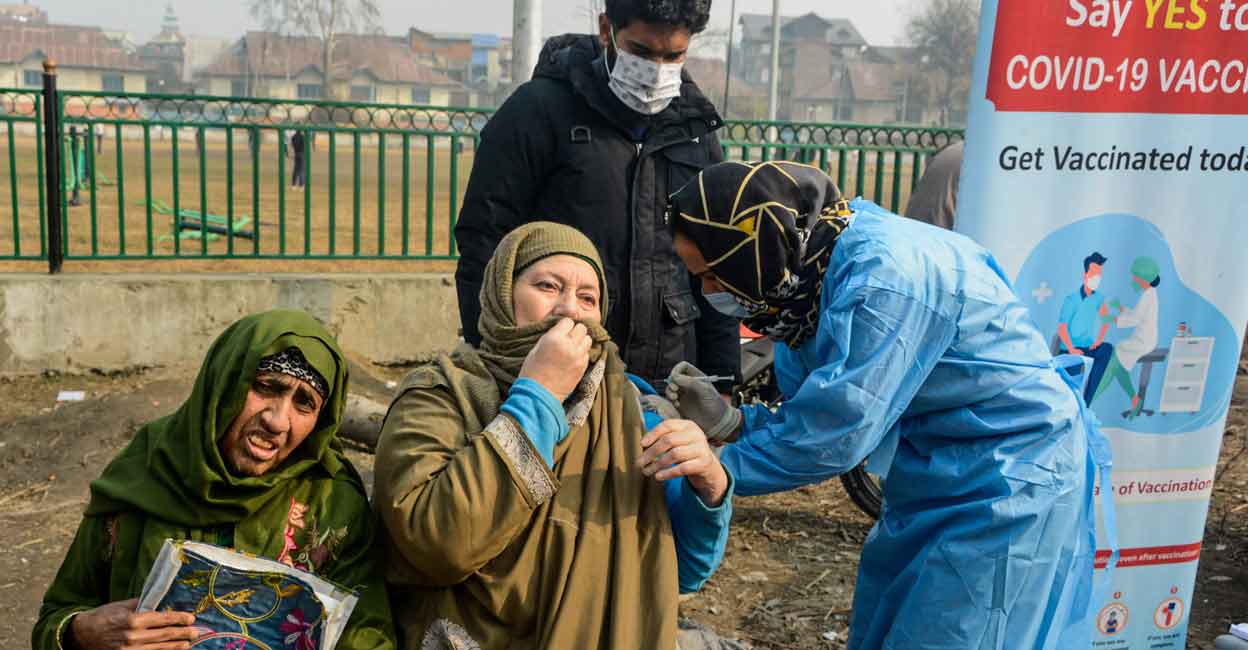 Covid vaccine A healthcare worker administers a dose of Covid-19 preventive vaccine to an elderly beneficiary during her registration for a government pension scheme for the elderly, in Srinagar, Monday, Dec. 19, 2022. Photo: PTI