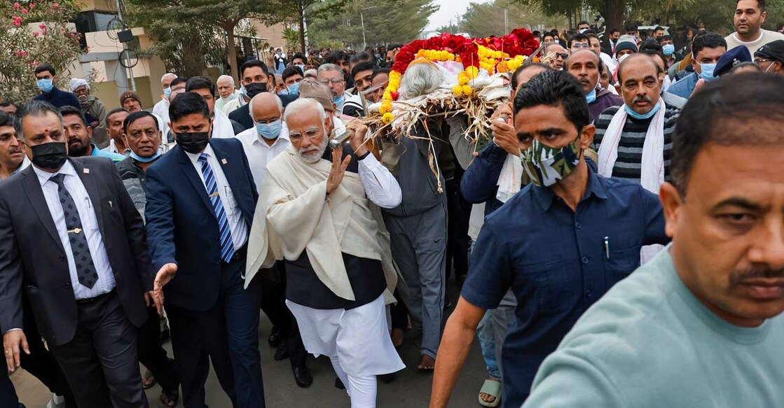 Prime Minister Narendra Modi carries mortal remains of his mother Heeraben Modi, who passed away at the age of 100, in Gandhinagar, Friday, Dec. 30, 2022: PTI