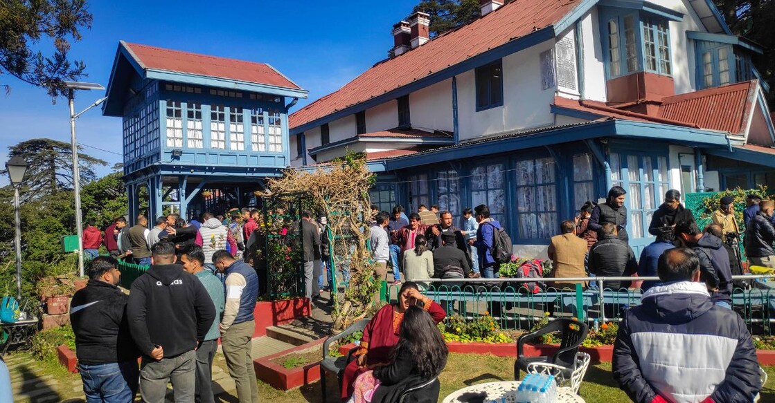 Media and Congress party workers outside the residence of party's Himachal Pradesh incharge Pratibha Singh, in Shimla, Thursday, Dec. 8, 2022. Photo: PTI. 