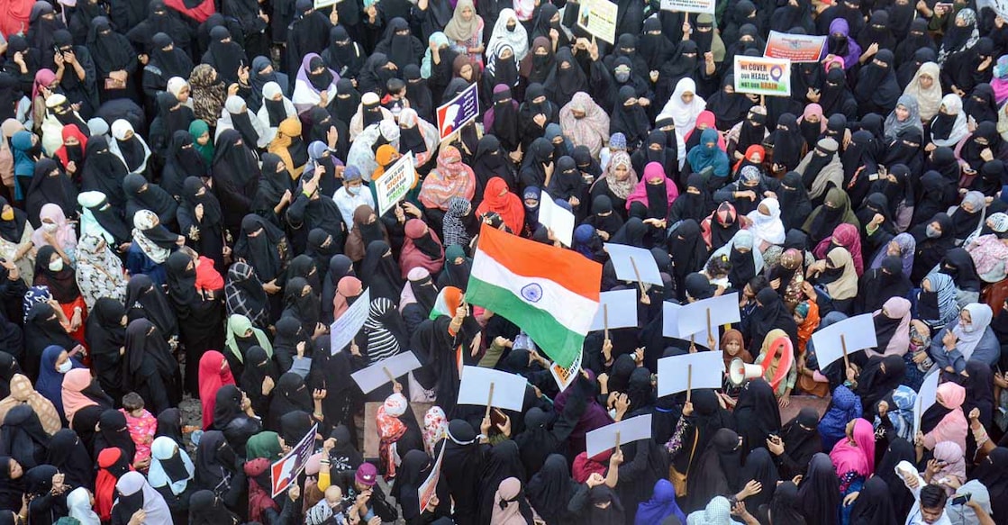 Karnataka Women hold placards as they stage a protest in support of female Muslim students of Karnataka over 'hijab' issue, in Thane, Sunday, February 13, 2022. Photo: PTI