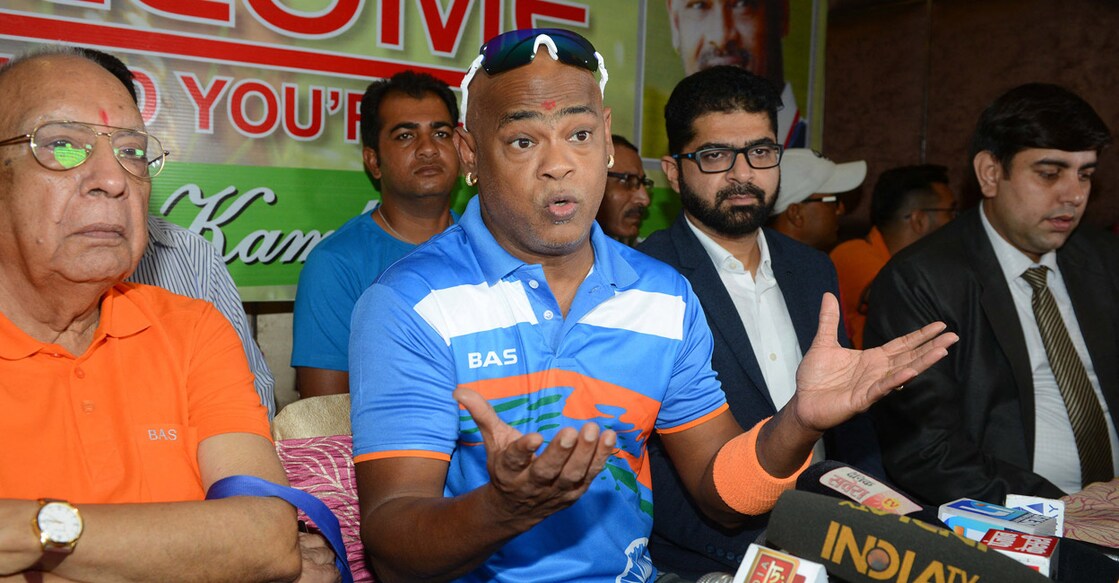 Former Indian batter Vinod Kambli, centre. File photo: AFP/Narinder Nanu