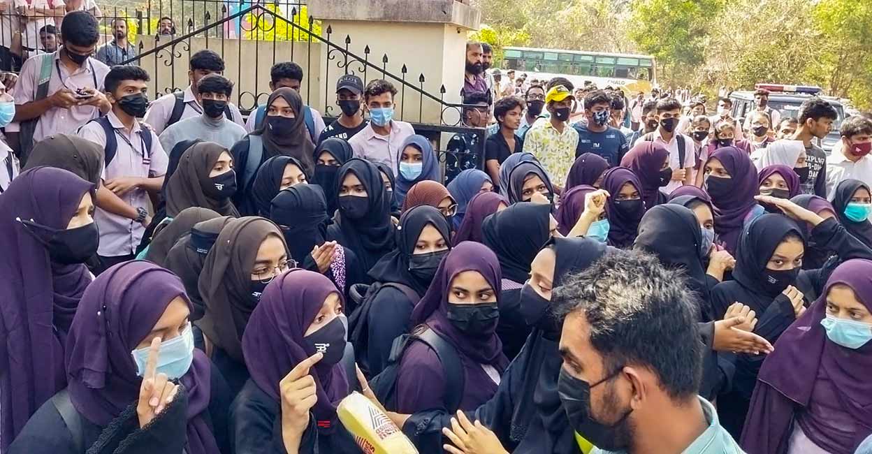 Students wearing hijab stage a protest outside the Mahatma Gandhi Memorial College campus, in Udupi district, Tuesday, Feb. 8, 2022. Photo: PTI