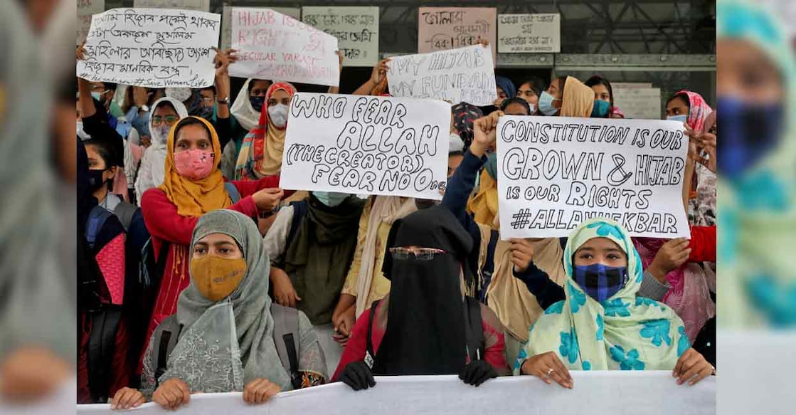 Hijab Muslim students display placards during a protest against the recent hijab row in Karnataka, at Aliah University in Kolkata on Wednesday. Photo: Reuters