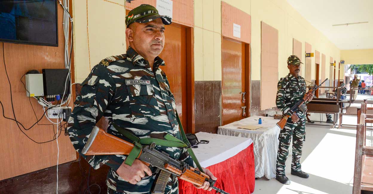 PTI03_09_2022_000084B Paramilitary personnel stand at guard outside a sealed 'strong room', where Electronic Voting Machines (EVMs) are kept, a day before the result of Punjab Assembly polls, in Amritsar, Wednesday, March 9, 2022. Photo: PTI