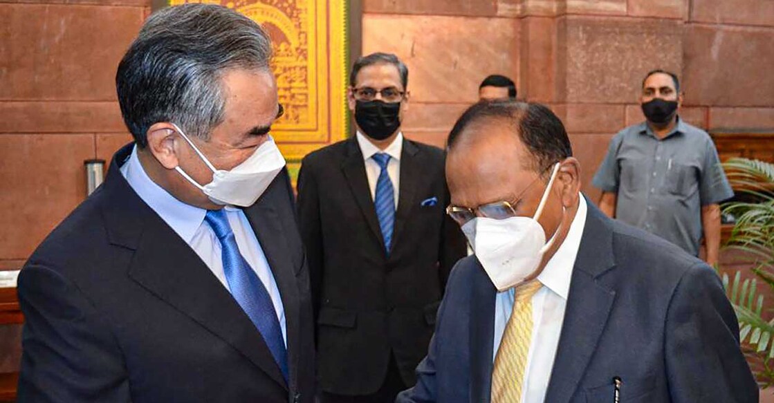 NSA meets Chinese Foreign Minister, calls for complete disengagement of troops in eastern Ladakh China's Foreign Minister Wang Yi shakes hands with National Security Adviser Ajit Doval, during their meeting, at the South Block, in New Delhi, Friday, March 25, 2022. PTI