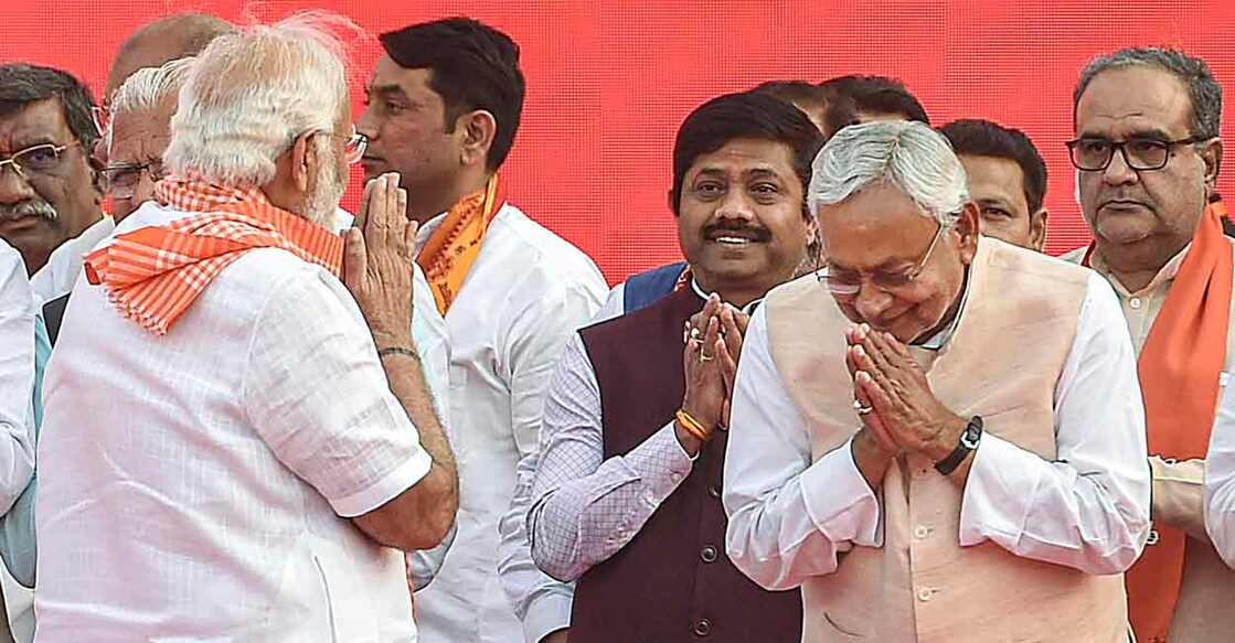 Bihar CM Nitish Kumar greets Prime Minister Narendra Modi during Yogi Adityanath's swearing-in ceremony as Uttar Pradesh Chief Minister in Lucknow. File photo: PTI