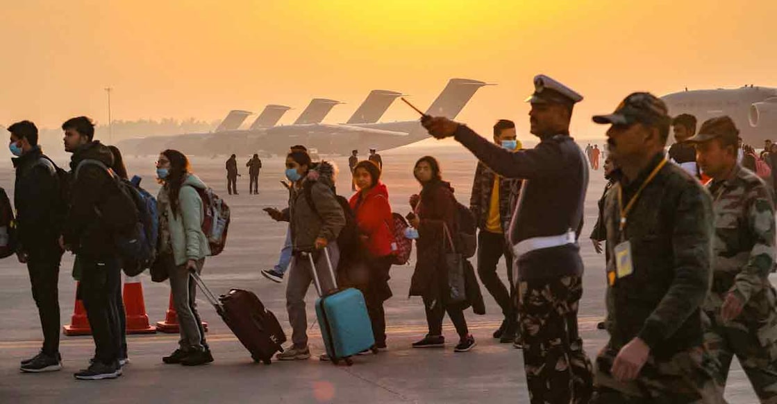 Indian nationals from Ukraine upon their arrival at the Hindon Air Force Station in Ghaziabad, early Thursday. Photo: PTI