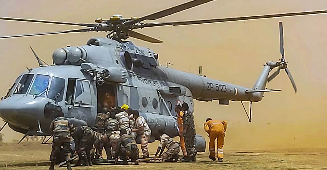 Indo-Tibetan Border Police (ITBP) and National Disaster Response Force (NDRF) personnel during a rescue operation after the collision of two cable cars at Trikut Ropeway, in Deoghar. PHOTO: PTI