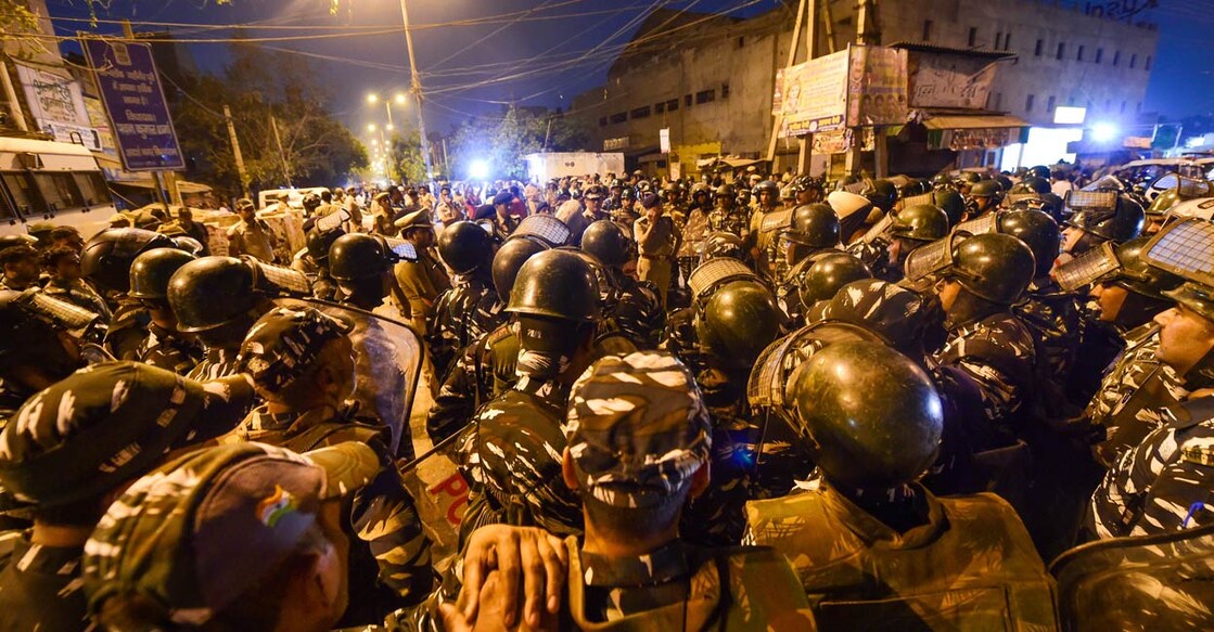 PTI04_16_2022_000332B Heavy police deployment after violent clashes broke out during a Hanuman Jayanti procession at Jahangirpuri, in New Delhi, Saturday, April 16, 2022. PHOTO: PTI