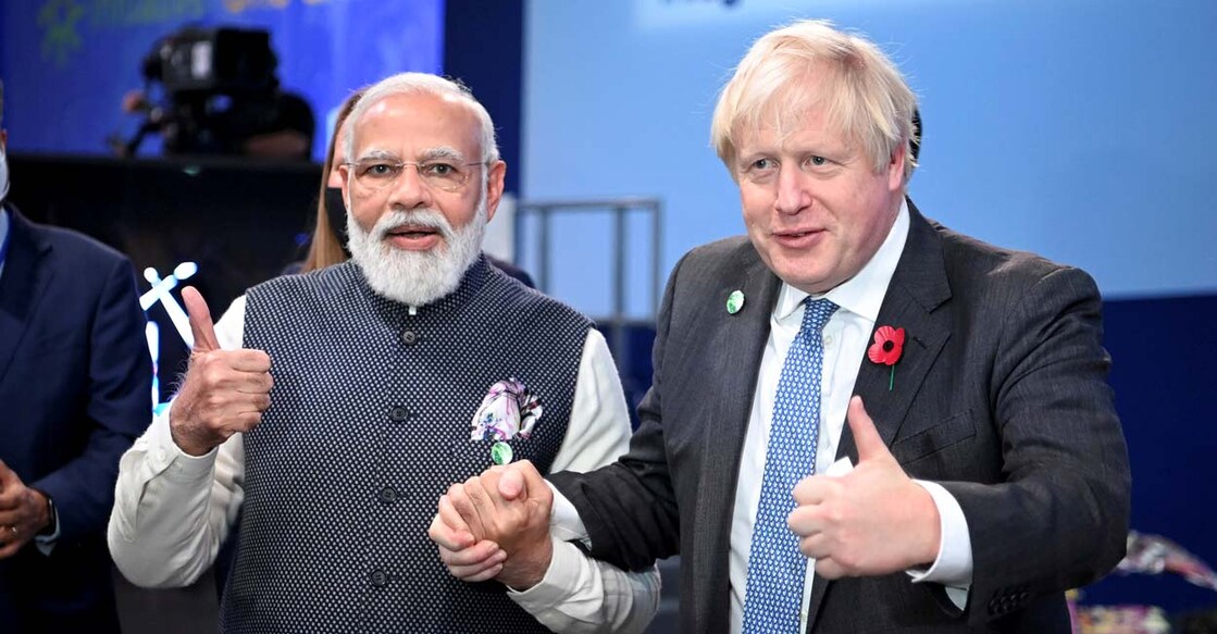 Britain's Prime Minister Boris Johnson and India's Prime Minister Narendra Modi attend the "Accelerating Clean Technology Innovation and Deployment" session at the UN Climate Change Conference (COP26) in Glasgow, Scotland, Britain November 2, 2021. Photo: Jeff J Mitchell/Pool via Reuters