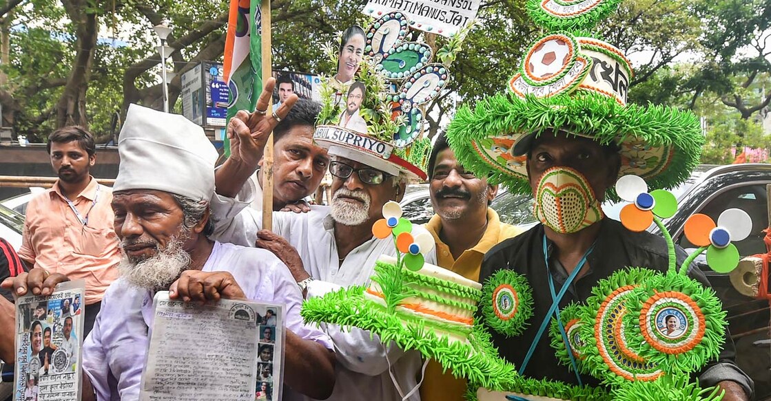 TMC supporters celebrate after their candidate Babul Supriyo won Ballygunge Assembly by-polls in Kolkata, Saturday, April 16, 2022. PHOTO: PTI/Swapan Mahapatra