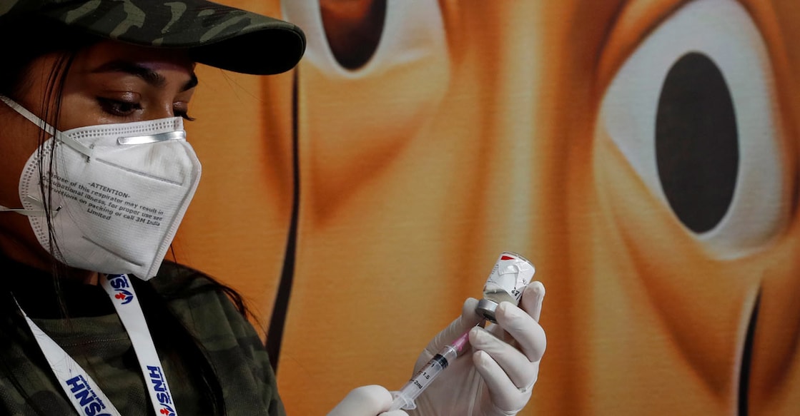 A healthcare worker fills a syringe with a dose of the Covaxin coronavirus disease vaccine manufactured by Bharat Biotech. File Photo: Reuters/Adnan Abidi