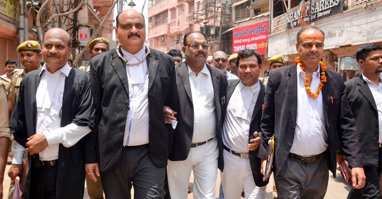 Vishal Singh Court Commissioners Vishal Singh (2L) and Ajay Pratap Singh (L) with their team leave after the third and last day of a videographic survey at Gyanvapi Mosque complex, in Varanasi, Monday, May 16, 2022. Photo: PTI