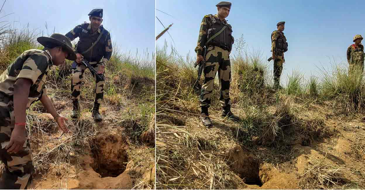 Border Security Force (BSF) personnel stand near a suspected underground tunnel which was detected near the Indo-Pak international border in the Samba district of Jammu and Kashmir, Thursday, May 5, 2022. (PTI Photo)