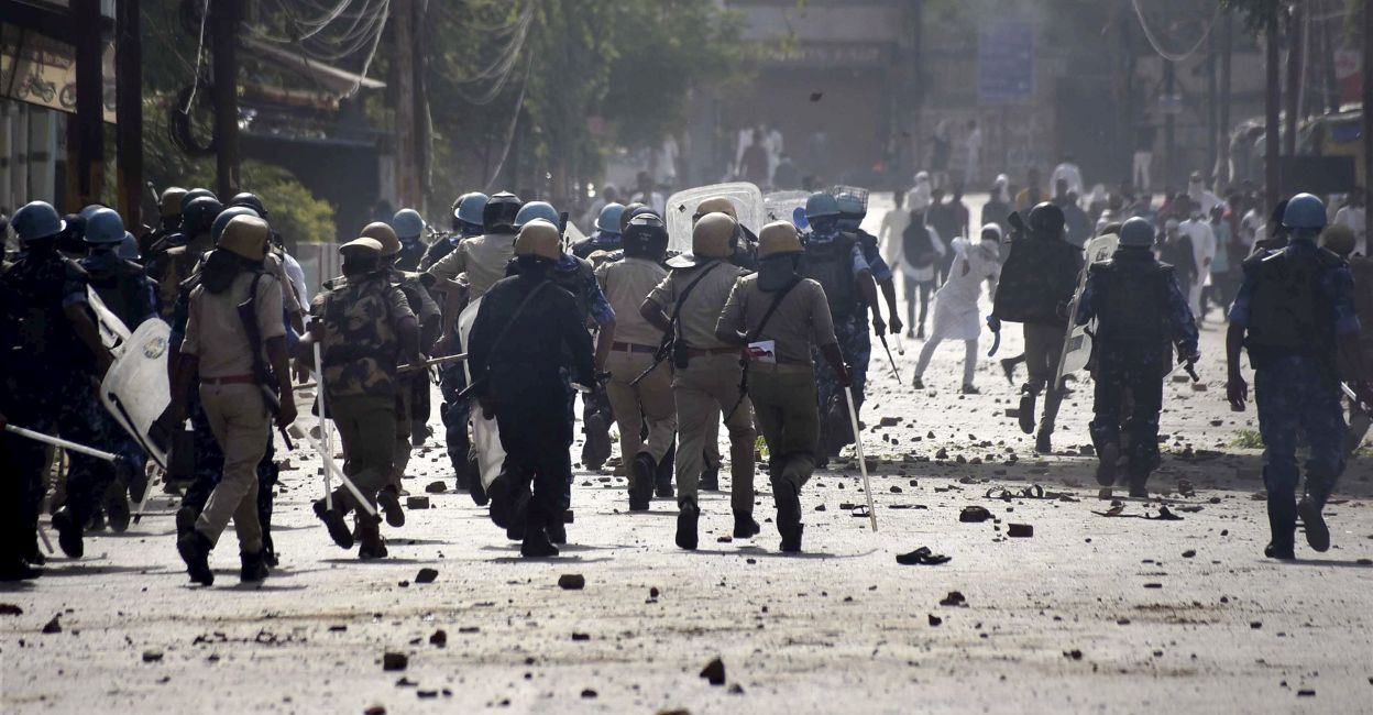 Brick-bats lie on the road as police personnel attempt to disperse agitators during a protest over the controversial remarks made by now-suspended BJP leaders against Prophet Mohammad, after the Friday prayers, in Prayagraj, Friday, June 10, 2022. PHOTO: PTI
