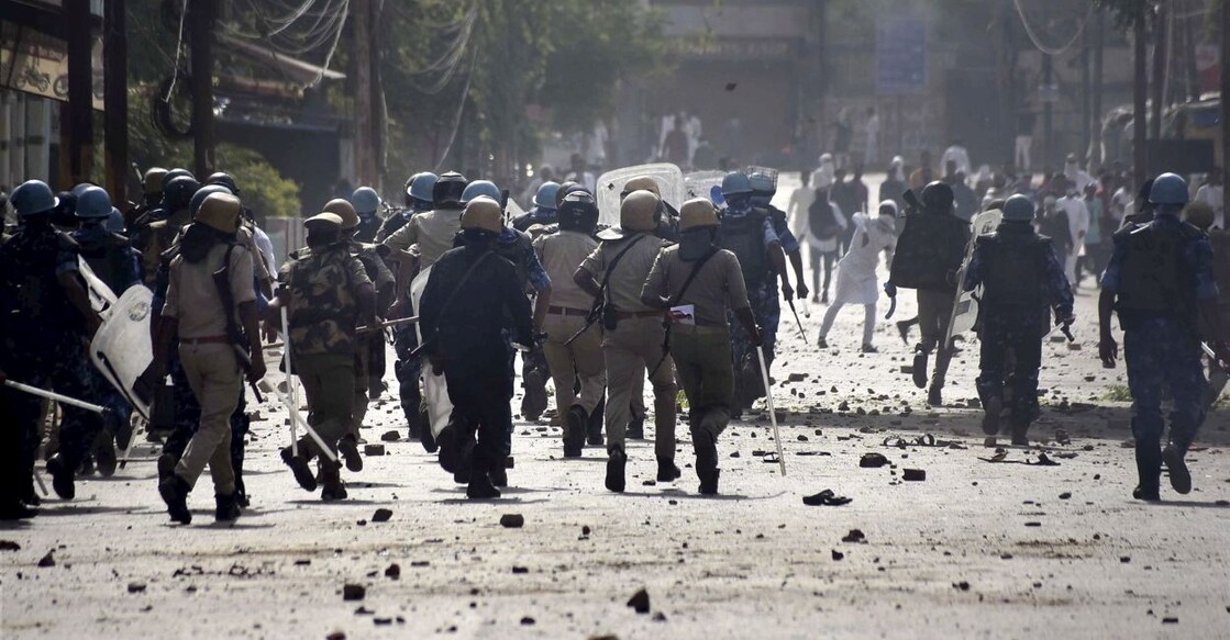 up-violence Brick-bats lie on the road as police personnel attempt to disperse agitators during a protest over the controversial remarks made by now-suspended BJP leaders against Prophet Mohammad, after the Friday prayers, in Prayagraj, Friday, June 10, 2022. PHOTO: PTI