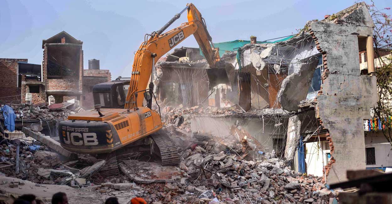 Prayagraj Bulldozer being used to demolish the residence of Javed Ahmed, a local leader who was allegedly the key conspirator of violent protests against now-suspended BJP leaders' remarks on Prophet Muhammad, in Prayagraj, Sunday, June 12, 2022. Photo: PTI