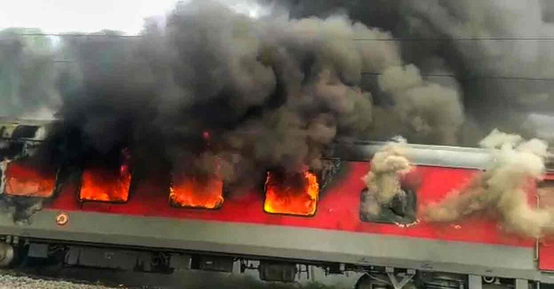 Lakhisarai: Jammu Tawi Guwahati Express train set on fire by a mob in protest against the Centre's 'Agnipath' scheme, in Hajipur, Friday, June 17, 2022. (PTI Photo)