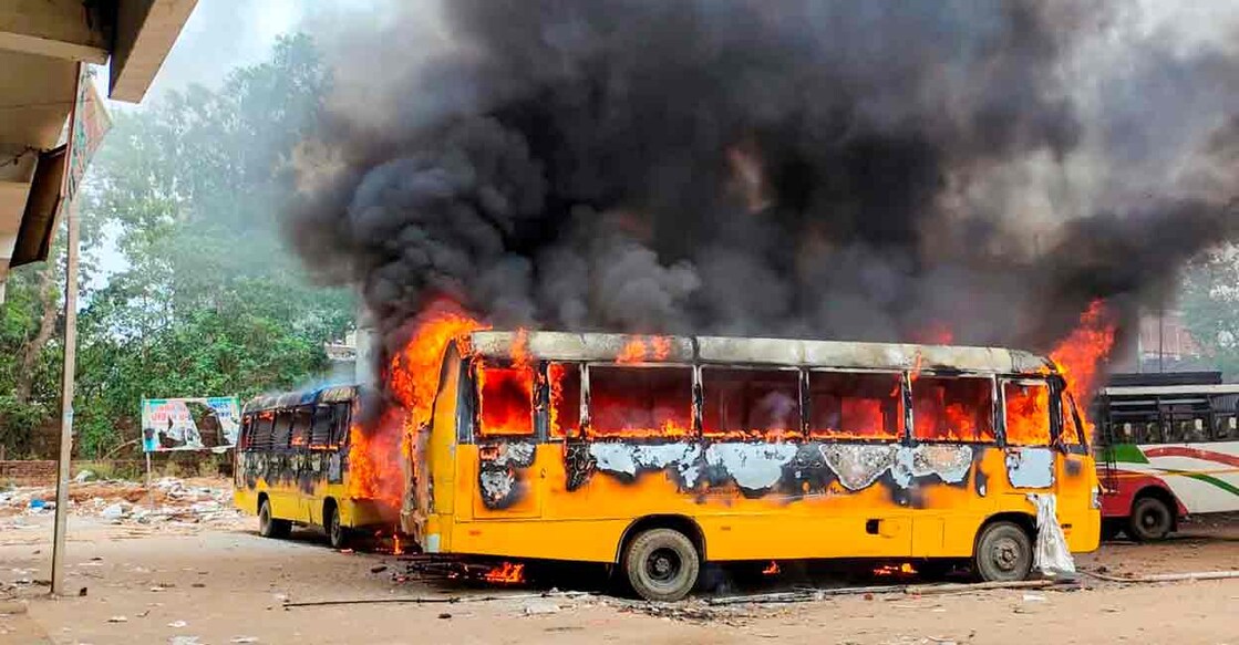 Smoke billows from buses after they were set on fire by people protesting against Centre's 'Agnipath' scheme, in Aurangabad, Friday, June 17, 2022. (PTI Photo)