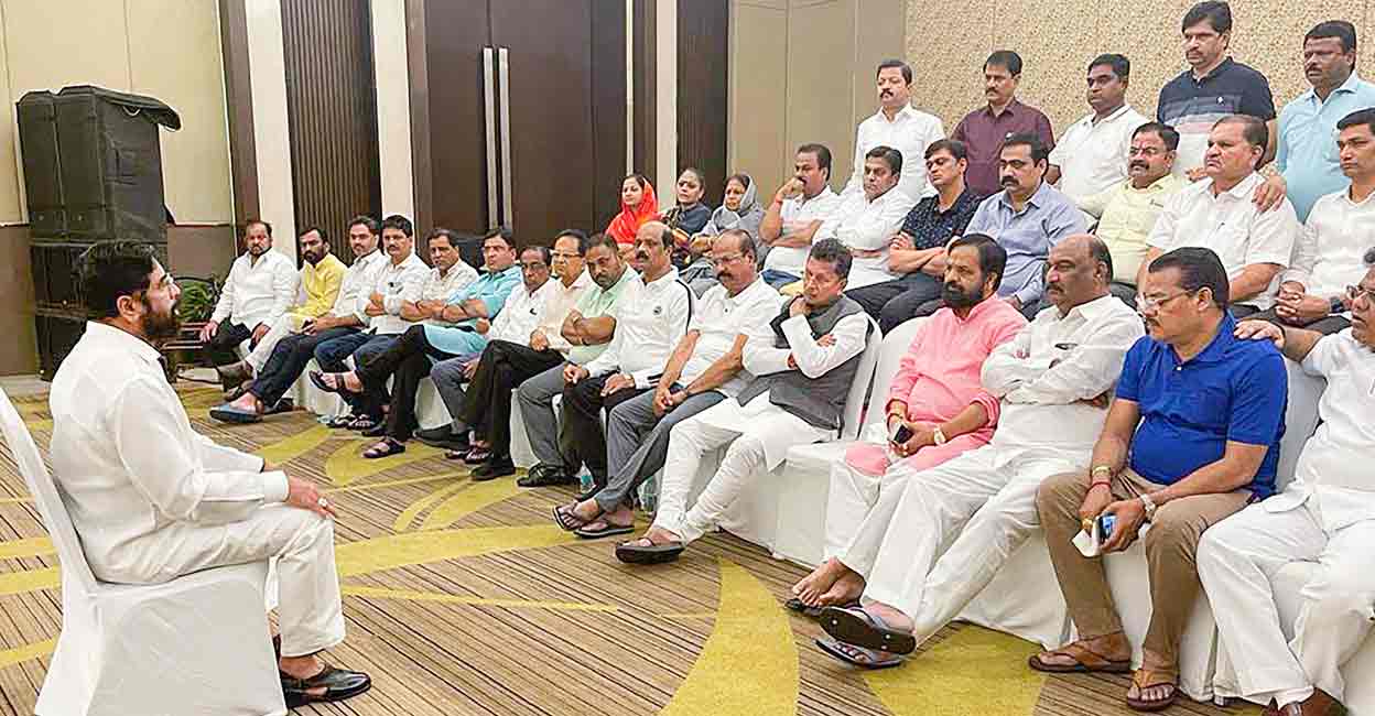 PTI06_23_2022_000153B Rebel Shiv Sena leader Eknath Shinde interacts with supporting MLAs at a hotel in Guwahati, Thursday, June 23, 2022. (PTI Photo)