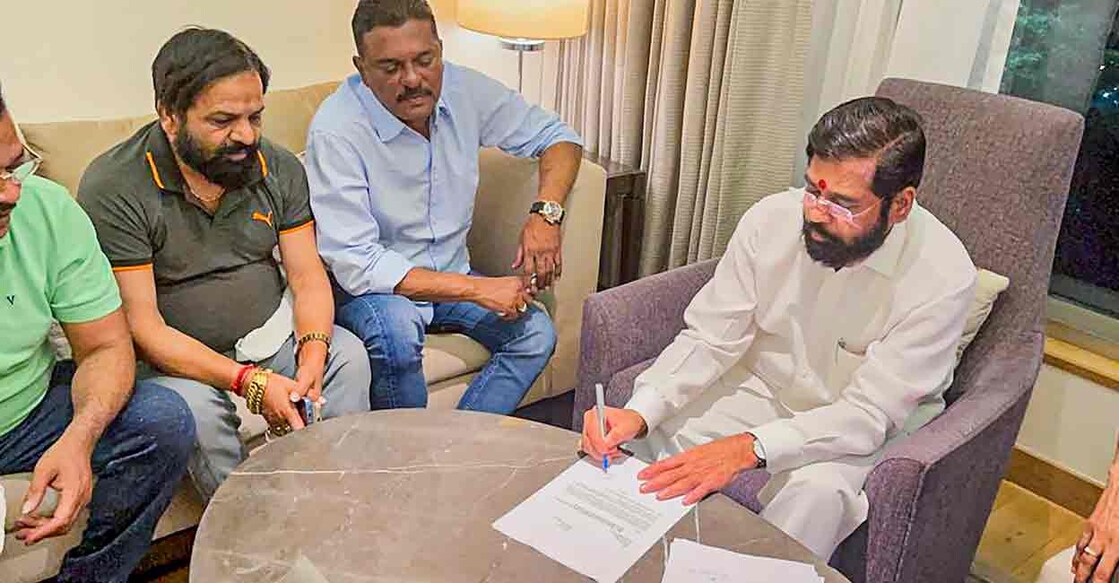 Rebel Shiv Sena leader Eknath Shinde with other MLAs during a meeting, in Guwahati, Wednesday, June 22, 2022. (PTI Photo)