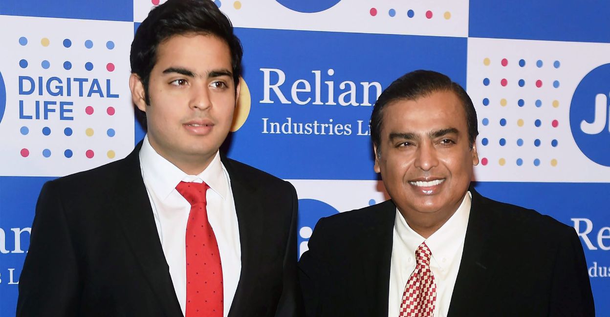 Akash Ambani with his dad Mukesh Ambani. Photo: PTI